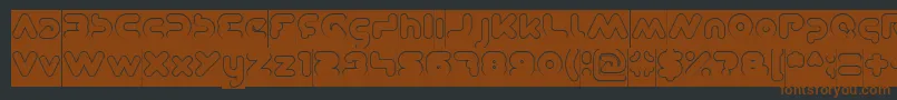 DominiqueHollowInverse-fontti – ruskeat fontit mustalla taustalla