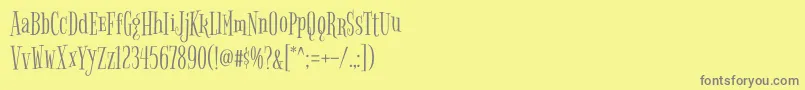 フォントBigelowrulesRegular – 黄色の背景に灰色の文字