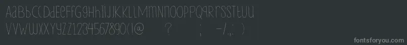DkLampion-fontti – harmaat kirjasimet mustalla taustalla