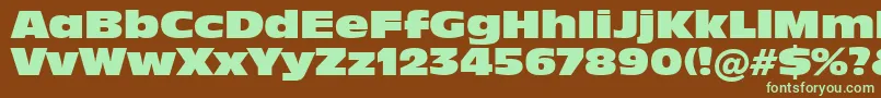 フォントIncised901NordBt – 緑色の文字が茶色の背景にあります。
