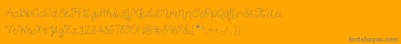 JustForGigglesSkinny-Schriftart – Graue Schriften auf orangefarbenem Hintergrund