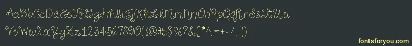 Czcionka JustForGigglesSkinny – żółte czcionki na czarnym tle