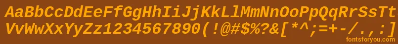 フォントCousineBoldItalic – オレンジ色の文字が茶色の背景にあります。