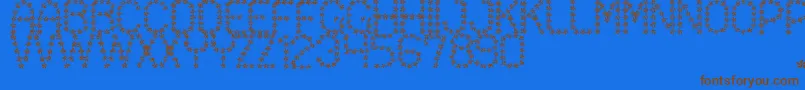 フォントFloweredSt – 茶色の文字が青い背景にあります。