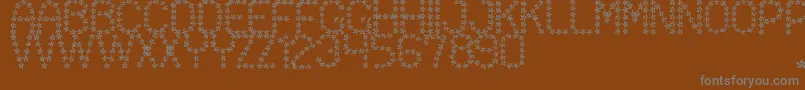 Шрифт FloweredSt – серые шрифты на коричневом фоне