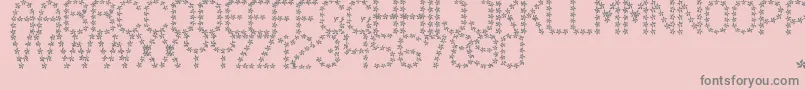 FloweredSt-fontti – harmaat kirjasimet vaaleanpunaisella taustalla