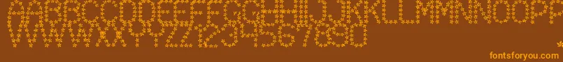 Czcionka FloweredSt – pomarańczowe czcionki na brązowym tle