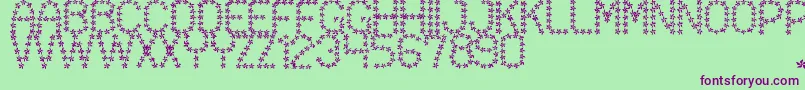フォントFloweredSt – 緑の背景に紫のフォント