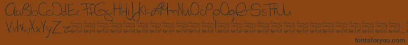 Czcionka SlRunawayGirl – czarne czcionki na brązowym tle