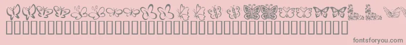 KrButterflies-fontti – harmaat kirjasimet vaaleanpunaisella taustalla