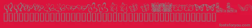KrButterflies-Schriftart – Graue Schriften auf rotem Hintergrund