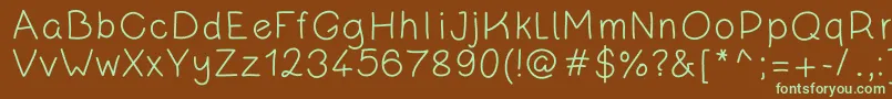フォントKanadaRegular – 緑色の文字が茶色の背景にあります。