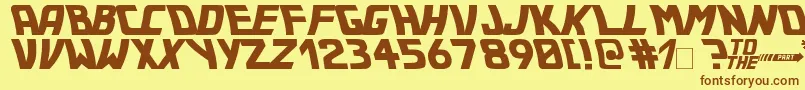 フォントBttf – 茶色の文字が黄色の背景にあります。