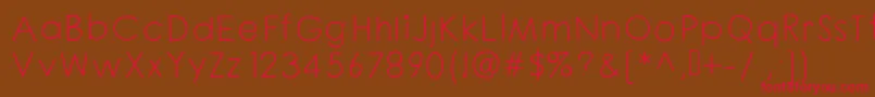 フォントChloouioui – 赤い文字が茶色の背景にあります。