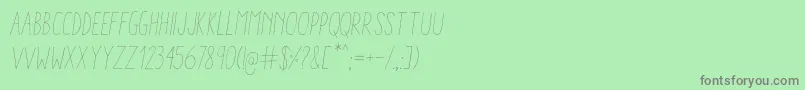 フォントAracneCondensedLightItalic – 緑の背景に灰色の文字