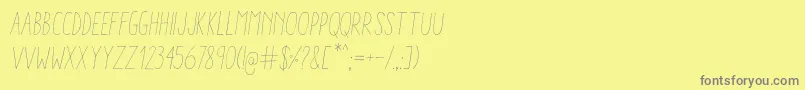 AracneCondensedLightItalic-Schriftart – Graue Schriften auf gelbem Hintergrund
