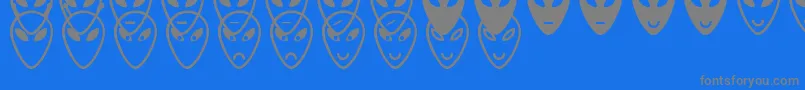 AlienFacesSt-Schriftart – Graue Schriften auf blauem Hintergrund