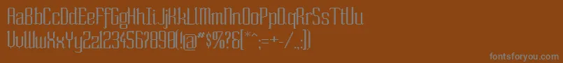 Soext Font – Gray Fonts on Brown Background