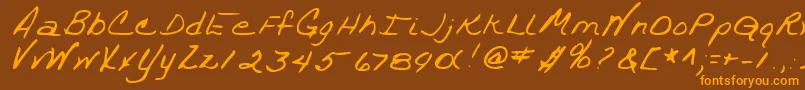 フォントTrixieshandRegular – オレンジ色の文字が茶色の背景にあります。