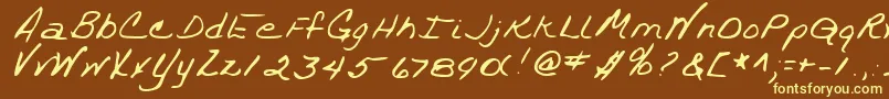 TrixieshandRegular-fontti – keltaiset fontit ruskealla taustalla