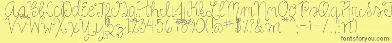 RoseCharming Font – Gray Fonts on Yellow Background