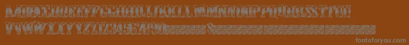 Czcionka Cowboywould – szare czcionki na brązowym tle