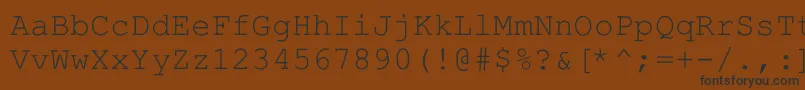 フォントHellascour – 黒い文字が茶色の背景にあります