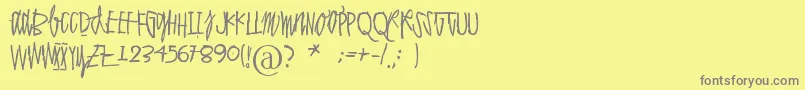 Polvihumppilasanoo-Schriftart – Graue Schriften auf gelbem Hintergrund