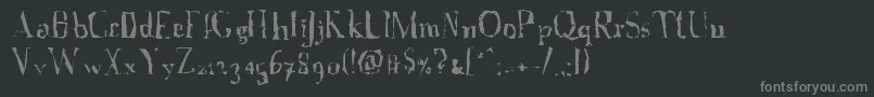 フォントAFontWithSerifs.Disordered – 黒い背景に灰色の文字