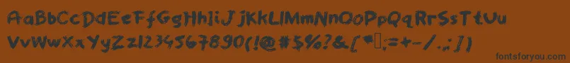 Fonte Worstpaintjobever – fontes pretas em um fundo marrom
