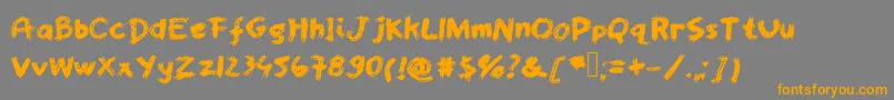 フォントWorstpaintjobever – オレンジの文字は灰色の背景にあります。