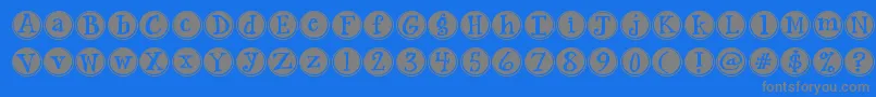 Jandasiestasunrise-Schriftart – Graue Schriften auf blauem Hintergrund