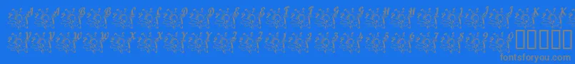 LcrJoyfulNoise-Schriftart – Graue Schriften auf blauem Hintergrund