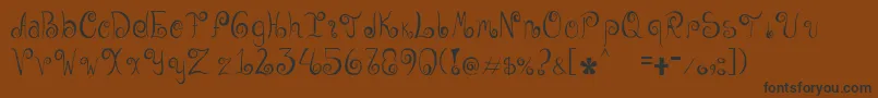 Geordana-Schriftart – Schwarze Schriften auf braunem Hintergrund