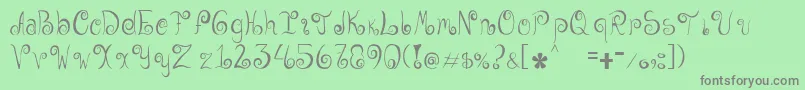 Geordana-Schriftart – Graue Schriften auf grünem Hintergrund
