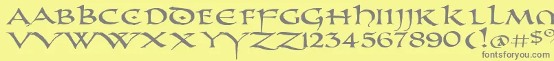 PrUncialAltCapsExtended-Schriftart – Graue Schriften auf gelbem Hintergrund