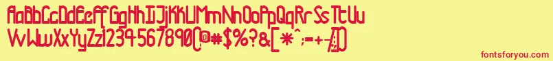 Tmtrn-Schriftart – Rote Schriften auf gelbem Hintergrund