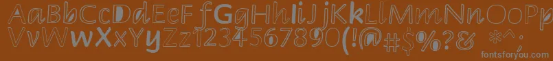 Peekaboo2 Font – Gray Fonts on Brown Background