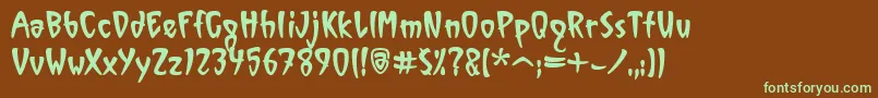 フォントVinylItcTt – 緑色の文字が茶色の背景にあります。