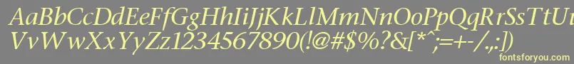 FasseItalic-fontti – keltaiset fontit harmaalla taustalla