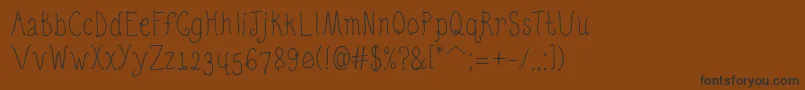 QuirkyNotsRegular Font – Black Fonts on Brown Background