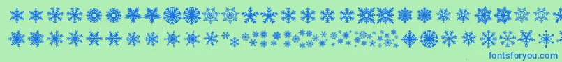 DhSnowflakes-Schriftart – Blaue Schriften auf grünem Hintergrund