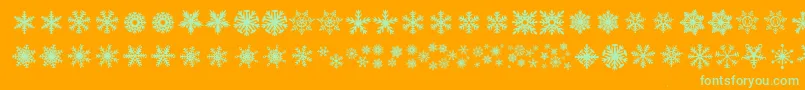 Fonte DhSnowflakes – fontes verdes em um fundo laranja