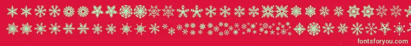 Fonte DhSnowflakes – fontes verdes em um fundo vermelho