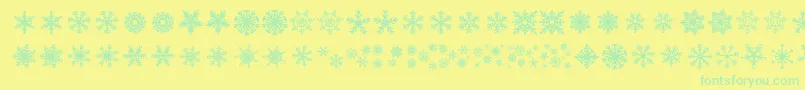 DhSnowflakes-Schriftart – Grüne Schriften auf gelbem Hintergrund