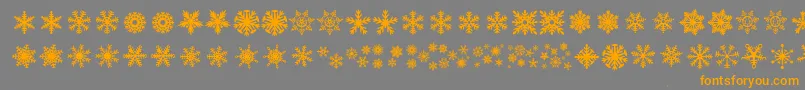 フォントDhSnowflakes – オレンジの文字は灰色の背景にあります。