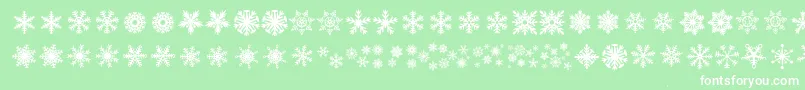 DhSnowflakes-Schriftart – Weiße Schriften auf grünem Hintergrund