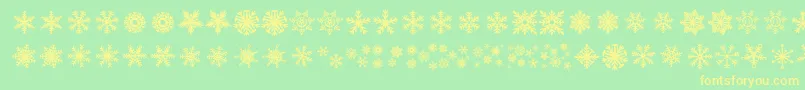 Fonte DhSnowflakes – fontes amarelas em um fundo verde