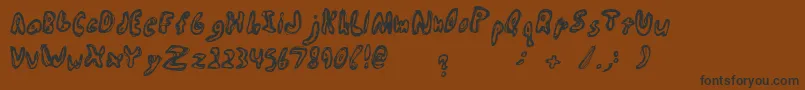 Abiscuos Font – Black Fonts on Brown Background