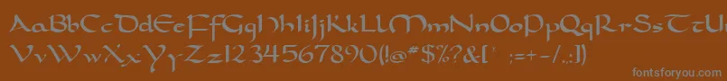 Dorcla-fontti – harmaat kirjasimet ruskealla taustalla